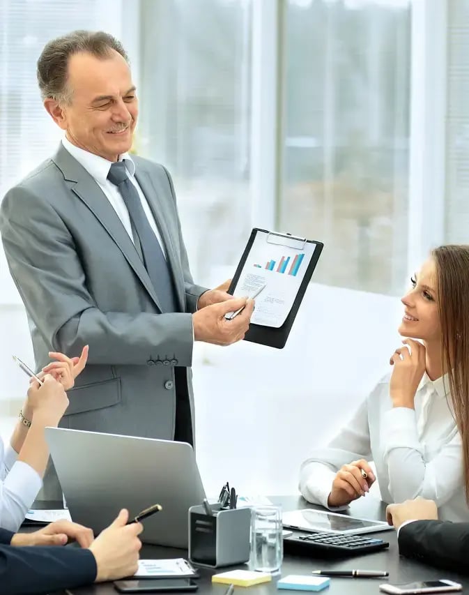 successful-businessman-his-business-team-meeting-modern-office 1 (1) (1) (1)
